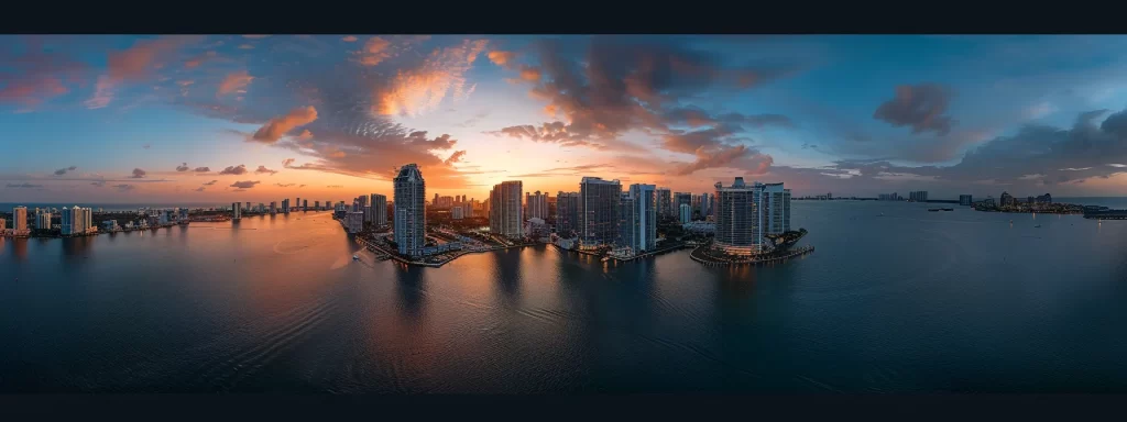 a breathtaking aerial view of miami's skyline at sunset, showcasing the luxurious condo towers of brickell key and the vibrant energy of midtown miami filled with modern amenities and nightlife.