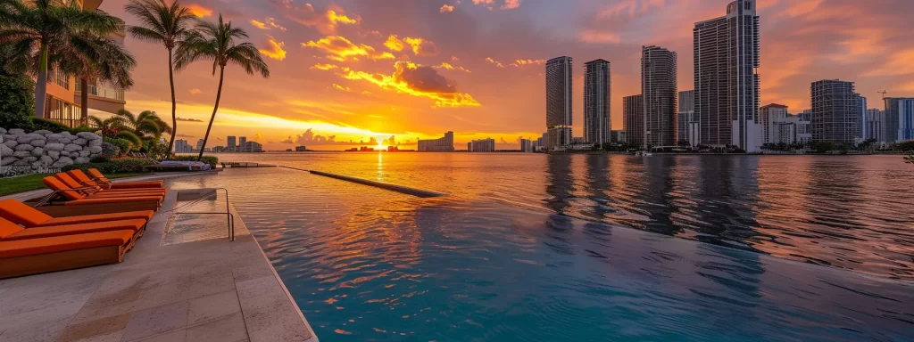 a luxurious waterfront condo's inviting pool area glimmers under the vibrant miami sunset, showcasing elegant loungers and palm trees that enhance the resort-style living experience.