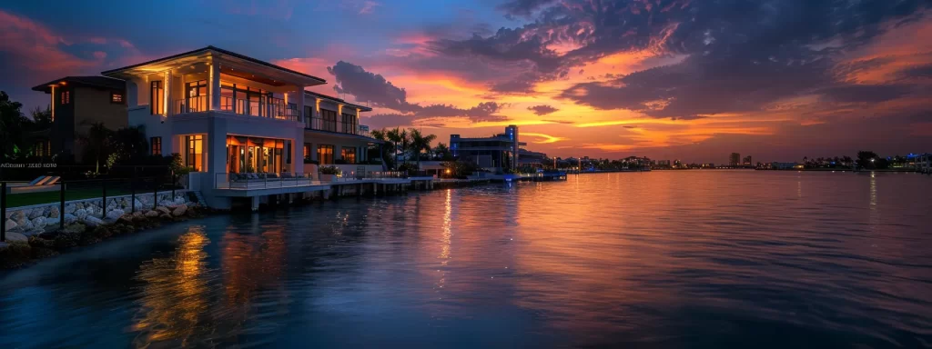 a stunning sunset casts a golden hue over luxury waterfront homes in miami, with tranquil waves lapping at the shore and vibrant city lights reflecting on the water, embodying the ultimate coastal lifestyle.