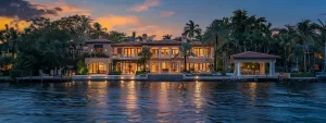 a vibrant miami skyline at sunset showcases uniquely designed homes with bold architectural features, surrounded by lush tropical vegetation and shimmering waters, creating an inviting and lively atmosphere.