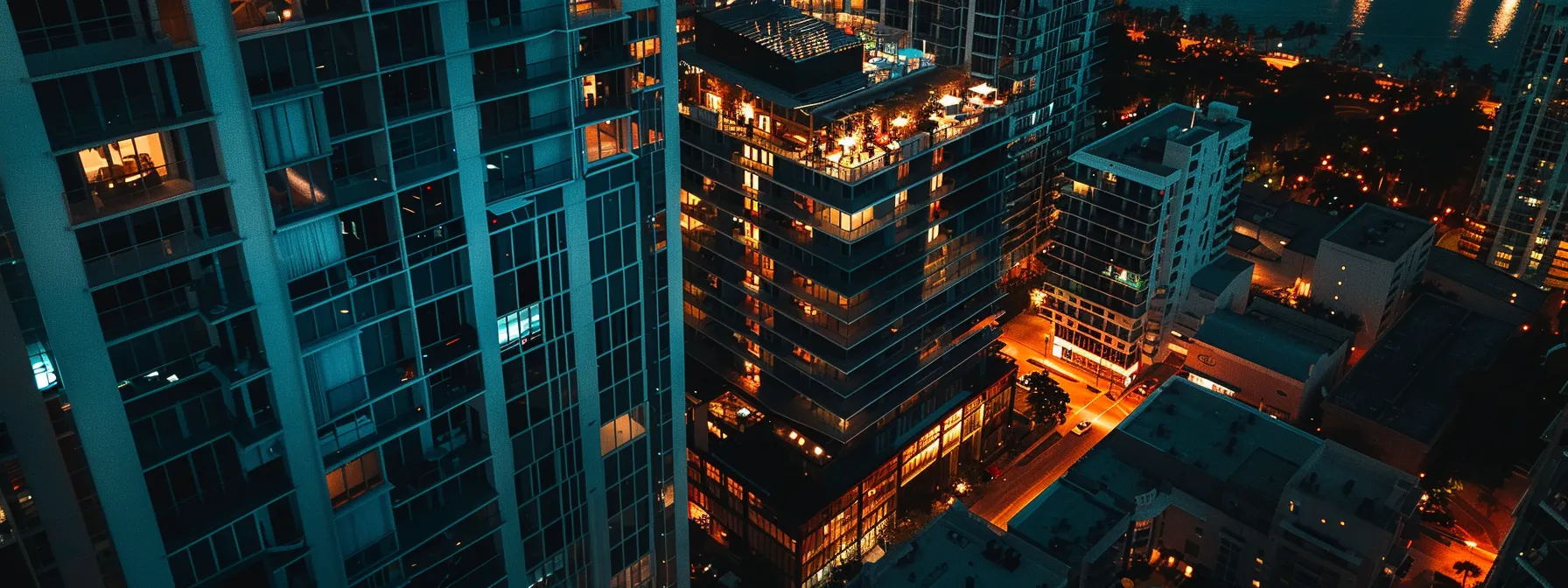 a vibrant miami nightlife scene featuring sleek high-rise condos illuminated against a backdrop of city lights and lively nightlife, with stylish rooftop bars and a hint of sunset glimmer on the water.